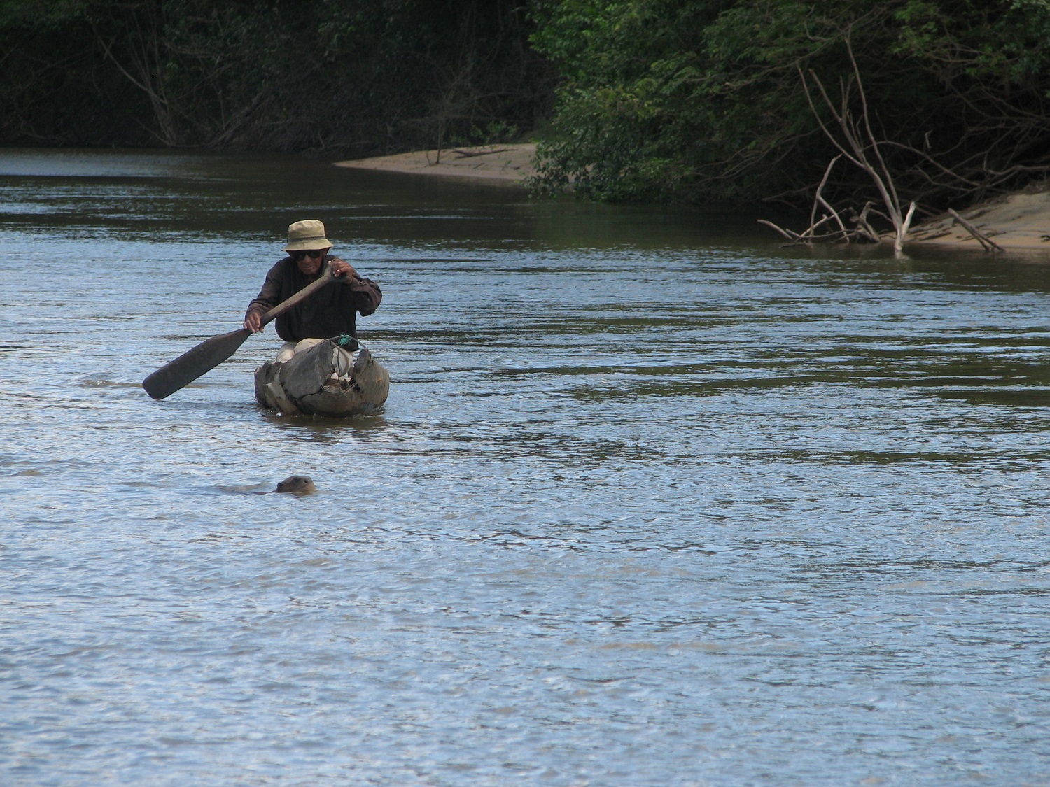 A fisherman on a river - when visiting Guyana you'll be taken back in time